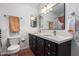 Bathroom with double vanity, modern lighting and decorative mirrors at 1817 W Seldon Ln, Phoenix, AZ 85021