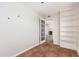 This stylish bedroom showcases built-in shelving with an doorway looking into the living area at 1817 W Seldon Ln, Phoenix, AZ 85021