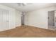 Spacious bedroom with attached bathroom and multiple closets at 1817 W Seldon Ln, Phoenix, AZ 85021