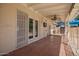 The covered patio boasts ceiling fan, privacy screen, outdoor TV, and a tile floor at 1817 W Seldon Ln, Phoenix, AZ 85021