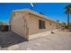 The property shows durable siding and a fenced backyard with low-maintenance gravel and stepping stones at 1817 W Seldon Ln, Phoenix, AZ 85021