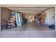 Spacious garage providing ample storage with assorted boxes, sporting goods, and laundry appliances at 1817 W Seldon Ln, Phoenix, AZ 85021