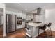 Modern kitchen featuring stainless steel appliances, center island, and ample counter space at 1817 W Seldon Ln, Phoenix, AZ 85021