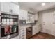 Modern kitchen with gray backsplash, stainless appliances, and bright, natural light at 1817 W Seldon Ln, Phoenix, AZ 85021