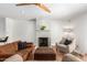Inviting living room featuring a fireplace, warm lighting, and a cozy seating arrangement at 1817 W Seldon Ln, Phoenix, AZ 85021