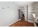 Neutral office with french doors leading to living area featuring large built-in shelving at 1817 W Seldon Ln, Phoenix, AZ 85021