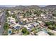 High-angle view of a housing development featuring diverse homes, green lawns, and neighborhood amenities at 18562 N Alamo Dr, Surprise, AZ 85374