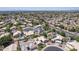 Expansive aerial view of a well-planned community with lush landscaping and a variety of home styles at 18562 N Alamo Dr, Surprise, AZ 85374