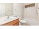 Clean bathroom with vanity, toilet, and tub/shower combo at 18562 N Alamo Dr, Surprise, AZ 85374