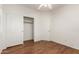 Simple bedroom with double door closet and hardwood floors at 18562 N Alamo Dr, Surprise, AZ 85374