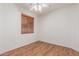 Cozy bedroom with hardwood floors and window with wood blinds at 18562 N Alamo Dr, Surprise, AZ 85374