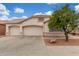 Charming single-Gathering home features a well-maintained yard with a spacious three-car garage at 18562 N Alamo Dr, Surprise, AZ 85374