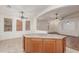 Kitchen island is the centerpiece of this open-concept room, connecting it to the living spaces at 18562 N Alamo Dr, Surprise, AZ 85374