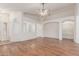 This light-filled living room features hardwood floors and arched doorways at 18562 N Alamo Dr, Surprise, AZ 85374