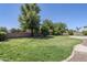 Picture of the backyard featuring green grass and trees creating a serene outdoor space at 18617 E Arrowhead Trl, Queen Creek, AZ 85142