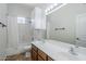 Bathroom featuring a double sink vanity, ample lighting, and a shower/tub combination with white shower curtain at 18617 E Arrowhead Trl, Queen Creek, AZ 85142