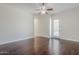 Large bedroom with wood floors, neutral walls, and lots of space at 18617 E Arrowhead Trl, Queen Creek, AZ 85142