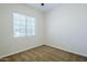 A carpeted bedroom has a window with blinds at 18617 E Arrowhead Trl, Queen Creek, AZ 85142