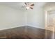 Large bedroom with wood floors, neutral walls, and lots of space at 18617 E Arrowhead Trl, Queen Creek, AZ 85142