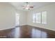Large bedroom with wood floors, neutral walls, and lots of space at 18617 E Arrowhead Trl, Queen Creek, AZ 85142