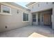 Inviting home exterior featuring a well-kept front porch with decorative lighting fixtures and a stylish wood door at 18617 E Arrowhead Trl, Queen Creek, AZ 85142