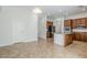 Spacious kitchen featuring stainless appliances, tile flooring, and a breakfast bar at 18617 E Arrowhead Trl, Queen Creek, AZ 85142