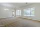 Open living room featuring plush carpeting, neutral paint, and a large window at 18617 E Arrowhead Trl, Queen Creek, AZ 85142