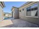 Exterior side view showcasing tile-paved patio, and beautifully textured stucco wall at 18617 E Arrowhead Trl, Queen Creek, AZ 85142
