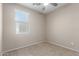Bedroom featuring plush carpet and a window, creating a cozy and inviting space at 18896 N Lariat Rd, Maricopa, AZ 85138