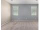 Bright bedroom with neutral carpeting, two-toned walls, and windows offering ample natural light at 18896 N Lariat Rd, Maricopa, AZ 85138