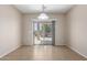 Bright dining area with tiled floors and sliding glass doors leading to the outdoor patio at 18896 N Lariat Rd, Maricopa, AZ 85138