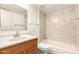 Bathroom featuring a tiled shower and a wood-look vanity at 1920 W Lindner Ave # 116, Mesa, AZ 85202