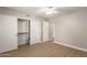 Neutral bedroom with ceiling fan, wood floors, and closet at 1920 W Lindner Ave # 116, Mesa, AZ 85202