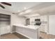 Updated white kitchen featuring breakfast bar and stainless steel appliances at 1920 W Lindner Ave # 116, Mesa, AZ 85202