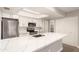 Modern kitchen showcasing stainless steel appliances, quartz counters, microwave, and plenty of cabinet space at 1920 W Lindner Ave # 116, Mesa, AZ 85202