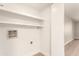 Laundry room with hookups and shelving at 1920 W Lindner Ave # 116, Mesa, AZ 85202