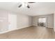 Spacious living room with fan, front door, and sliding glass doors at 1920 W Lindner Ave # 116, Mesa, AZ 85202