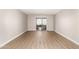 Open living room featuring sliding door with a view and vinyl floors at 1920 W Lindner Ave # 116, Mesa, AZ 85202