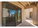 Condo patio features sliding glass door and concrete flooring at 1920 W Lindner Ave # 116, Mesa, AZ 85202
