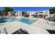 Community pool and spa with shade and lounge chairs at 1920 W Lindner Ave # 116, Mesa, AZ 85202