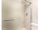 Bathroom shower with glass door and updated fixtures and neutral tile at 1920 W Lindner Ave # 116, Mesa, AZ 85202
