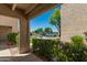 View from condo patio of landscaping, street and cars at 1920 W Lindner Ave # 116, Mesa, AZ 85202