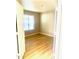 Cozy bedroom with laminate flooring, natural light, and minimalist design at 2025 E Campbell Ave # 132, Phoenix, AZ 85016