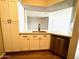 Well-designed kitchen featuring modern appliances, ample cabinet space and laminate flooring at 2025 E Campbell Ave # 132, Phoenix, AZ 85016