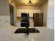 Modern kitchen with white cabinets, stainless steel appliances, and a stylish faucet at 2025 E Campbell Ave # 132, Phoenix, AZ 85016