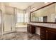 Elegant primary bathroom with dual sinks, soaking tub, and a walk-in shower at 2028 S Esmeralda --, Mesa, AZ 85209