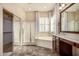 Beautiful bathroom featuring dual sinks, soaking tub, walk-in shower and ample natural light at 2028 S Esmeralda --, Mesa, AZ 85209