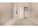 This bedroom features neutral walls, carpet, and a sliding closet door, offering ample storage and a doorway to other rooms at 2028 S Esmeralda --, Mesa, AZ 85209