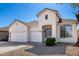 Attractive home exterior with a three-car garage, manicured landscaping, and welcoming front entrance at 2028 S Esmeralda --, Mesa, AZ 85209