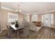 Inviting living room with elegant furnishings, wood floors, and abundant natural light at 2028 S Esmeralda --, Mesa, AZ 85209